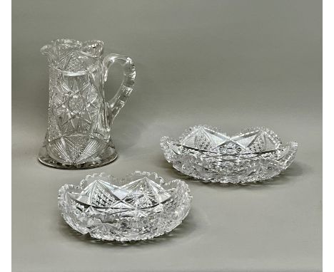 Three pieces of American cut glass - first half 20th century, comprising a heavy cut glass water or lemonade jug, with toothe
