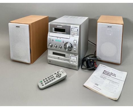 A vintage Sony CMT-CP100 Micro Hi-Fi Component stereo system - c.2001, with CD/Tape/radio, complete with remote control, pair