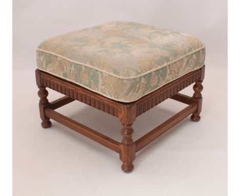 An Ercol elm square footstool - with removable cushion. (LWH 57 x 57 x 43cm)