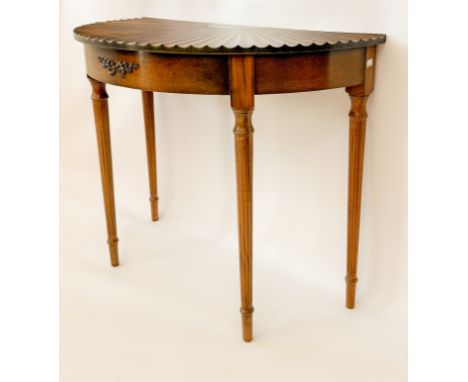 A Federal American style mahogany demi-lune fan table - first half 20th century, the fan-carved top over a tied ribbon mounte