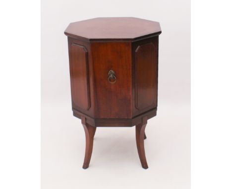 An octagonal mahogany drinks cabinet - second half 20th century, raised on four splayed supports. (LWH 45 x 45 x 70cm)
