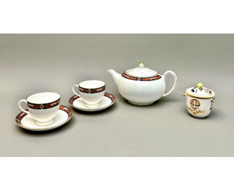 A Royal Doulton 'Chippendale' pattern teapot and two teacups and saucers - together with a French faience two-handled cup and