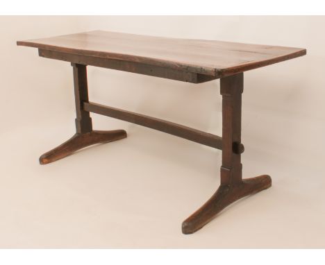 A joined oak refectory-style trestle table - 20th century using some earlier elements, the cleated, three-plank top on square
