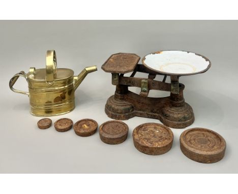 An antique brass hot water can - stamped '2' to base, 20cm high; together with a set of cast iron farm scales with enamel bow