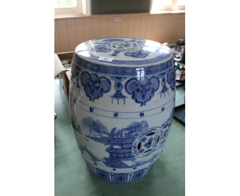 A Chinese ceramic garden seat plus a blue and white decoration with pagodas and landscape