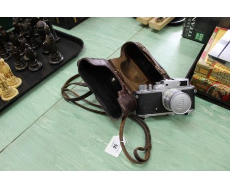 A 1960's Russian camera by 'Zorki' in carry case in the style of a Leica 
