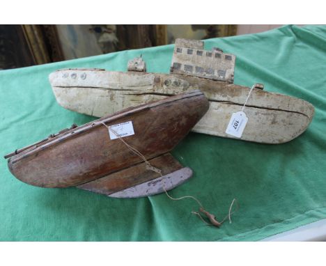 Two primitive model boats