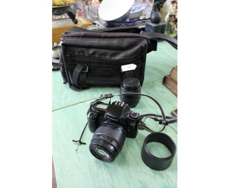 A Canon EOS 1000F SLR camera with two Sigma lenses in case