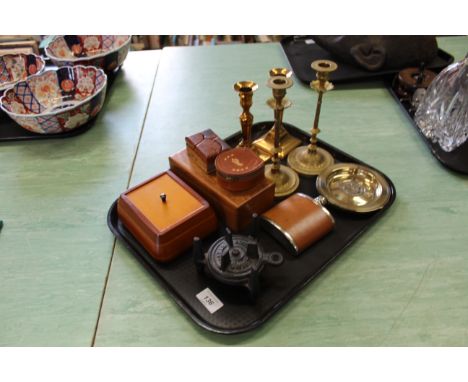 A tray with two pairs of brass candlesticks, wooden boxes, a 'Swift' spirit stove plus a hip flask