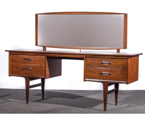 A Scandinavian teak dressing table, circa 1965, rectangular adjustable mirror, fitted with four drawers, tapering legs, lengt