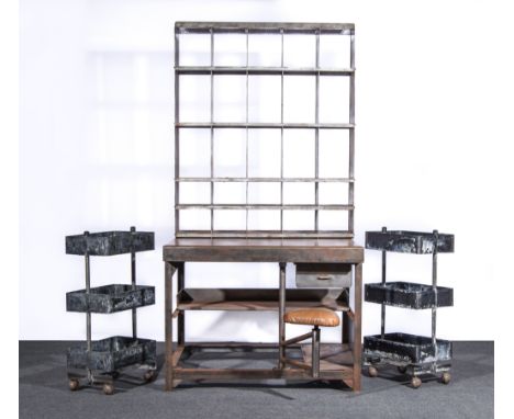 An Industrial office station, 20th century, steel and leather, upper section with arrangement of twenty five pigeon holes, ab