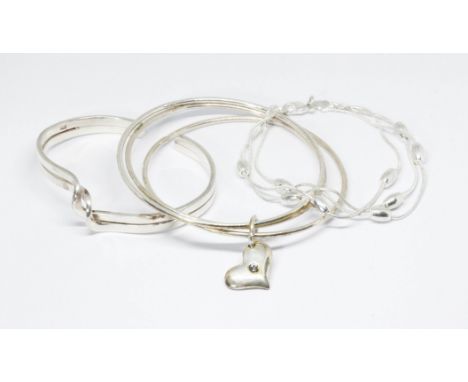 A bangle marked '925' and two others unmarked. 