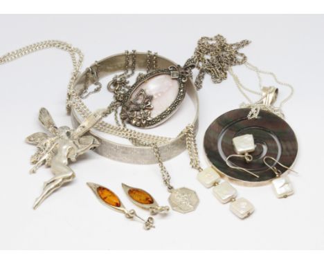 Assorted silver jewellery comprising a bangle, an Art Nouveau style pixie brooch, amber, mother of pearl etc. various marks. 