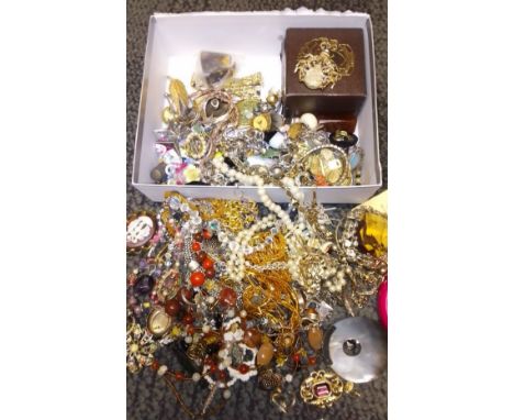 A box of assorted vintage and modern costume jewellery. 