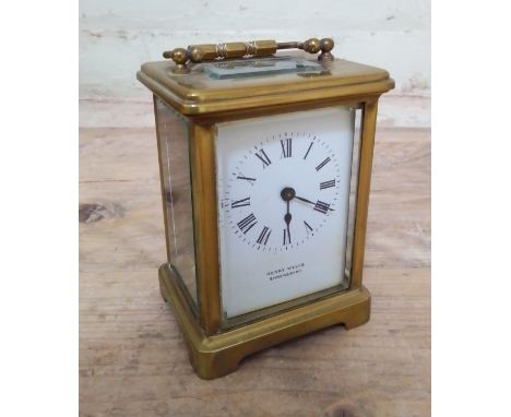 A gilt brass carriage clock, white enamel dial signed Henry Wells, Shrewsbury. 