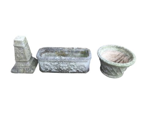 Three pieces of garden stoneware, comprising a stoneware trough planter, 70 by 26.5 by 26cm high, together with a circular fo