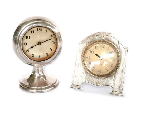 Two Edwardian silver desk clocks, one an Art Deco easel clock, 9.5cm high, the other ballon form, HAC Make, 11cm high. (2)