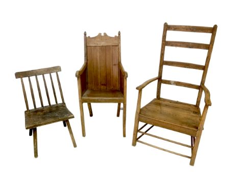 Three 19th century oak chairs, comprising a a pine armchair with solid back and armrests, 53 by 55 by 105cm high, a ladder ba