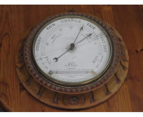 CARVED WOODEN CASED CIRCULAR BAROMETER BY H WALFORD & CO, GLASS DEFICIENT 