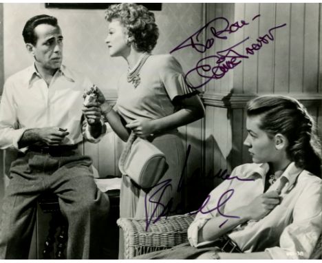 KEY LARGO: Signed 10 x 8 photograph by both Claire Trevor (Gaye Dawn) and Lauren Bacall (Nora Temple) individually, the image