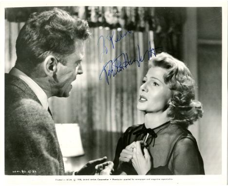 HAYWORTH RITA: (1918-1987) American actress. Vintage signed and inscribed 10 x 8 photograph of Hayworth in a head and shoulde
