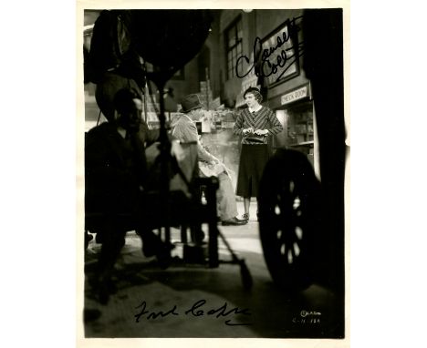 IT HAPPENED ONE NIGHT: Signed 8 x 10 photograph by both Frank Capra (director and co-producer) and Claudette Colbert (Ellen '