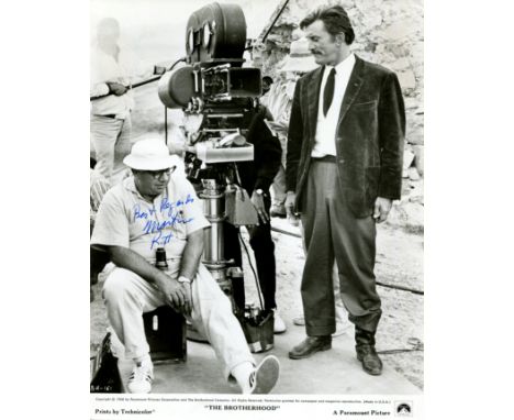 RITT MARTIN: (1914-1990) American film director. Signed 8 x 10 photograph of Ritt seated outdoors in a full-length pose, alon