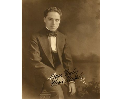 CHAPLIN CHARLES: (1889-1977) English film comedian, Academy Award winner. A fine vintage signed sepia 7.5 x 9.5 photograph of