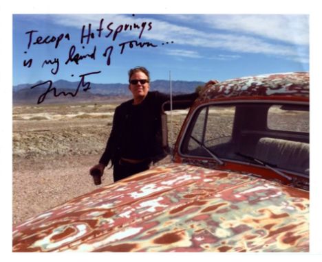WAITS TOM: (1949-&nbsp;&nbsp;&nbsp;&nbsp; ) American musician and actor. Signed colour 11 x 8.5 photograph of Waits standing 