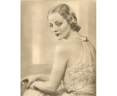 BANKHEAD TALLULAH: (1902-1968) American actress. A good vintage signed and inscribed sepia 8 x 10 photograph of Bankhead seat
