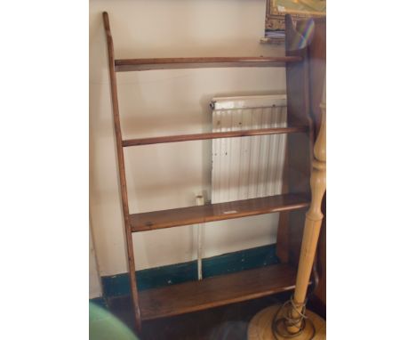 A mahogany wall shelf with four graduated shelves, 61cm wide, 106cm high
