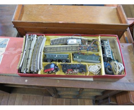 A Marklin HO/OO gauge train set, with FM800 locomotive and lender, two 3291 carriages and a 3294 guards van, boxed
