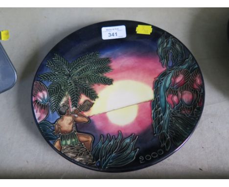 A Moorcroft limited edition Millenium plate depicting a sunset and figure playing a seashell, 1295 of 2000, impressed and pai