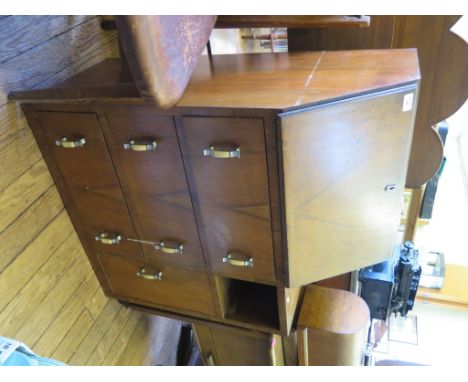 A 1930's walnut bureau, the sloping fall over three drawers beside a compartment and cupboard door, 76cm wide