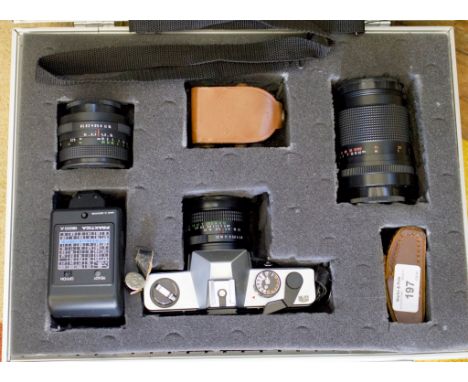 A Practica TL5B SLR camera, with Carl Zeiss 29mm lens, a Carl Zeiss 135mm 1:3.5f lens and a Pentacon 50mm 1.8 lens, flashgun,