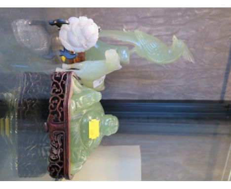 A collection of four pieces of carved jade