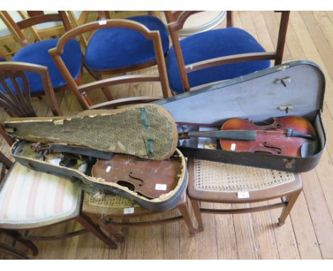 An early 20th century German violin with faux Stradivarius label, length of two piece back 33cm, with bow, and another violin