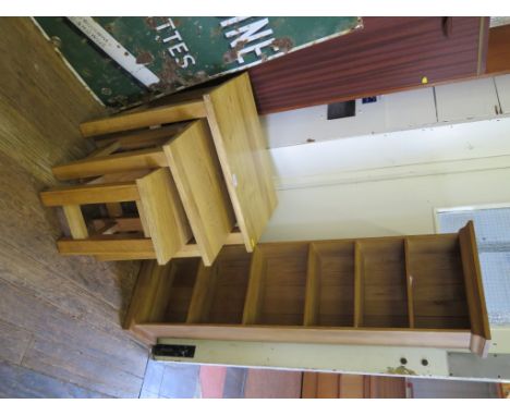 A nest of three light oak tables, and a CD rack (2)