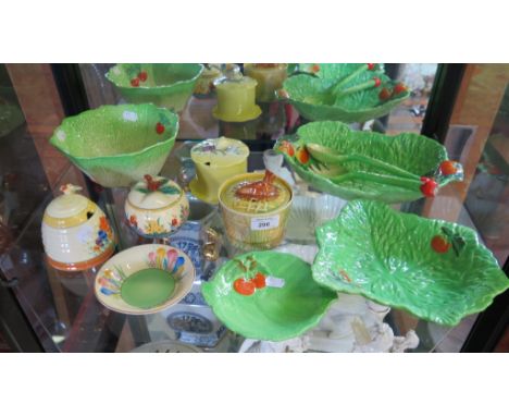 A Clarice Cliff for Newport pottery crocus pattern honeypot, 9cm high, various cabbage leaf pattern dishes and and other 1930