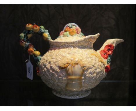 A Clarice Cliff for Newport pottery Celtic Harvest teapot, 15cm high