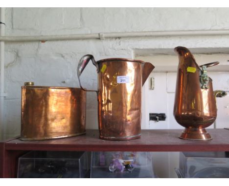 A copper hip shaped flask, 21cm high, a copper jug and another vessel in the form of a coal helmet (3)