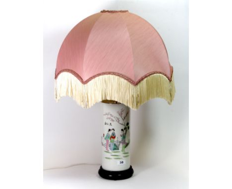 A 19th century Chinese hand painted porcelain cylinder vase mounted as a table lamp with a silk shade, H. 70cm overall.