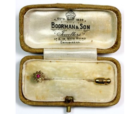 A Victorian yellow metal (tested minimum 9ct gold) stone set stick pin with its original box.