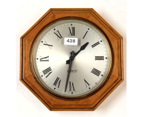An octagonal electric wall clock, Pu-syn-etic impulse clock by Gents of Leicester. W. 30cms