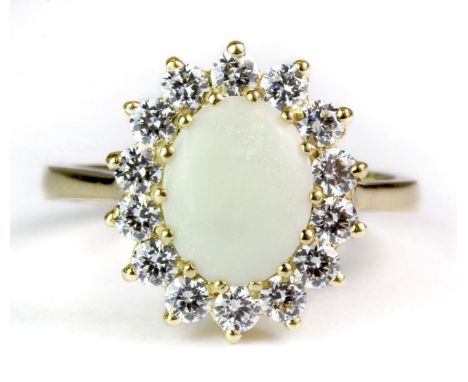 An 18ct yellow gold opal and cubic zirconia cluster ring (P).