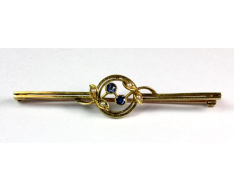 A Victorian 15ct yellow gold (stamped 15ct) sapphire and seed pearl set bar brooch.