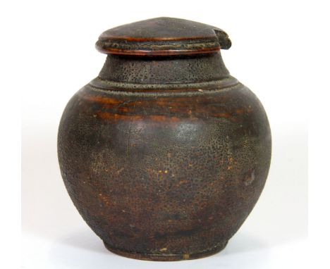 A rare 18th / early 19th century Tibetan turned wooden tea caddy, H. 11cm, Est. £200 - £300.