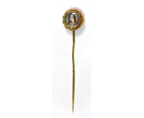 A rare Indian yellow metal (tested high carat gold) stick pin set with a hand painted miniature portrait of a young woman. We