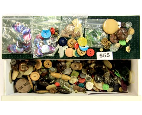 A box of vintage sets of buttons.