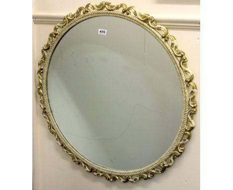 A vintage circular cream and gilt framed mirror, Dia. 77cm.